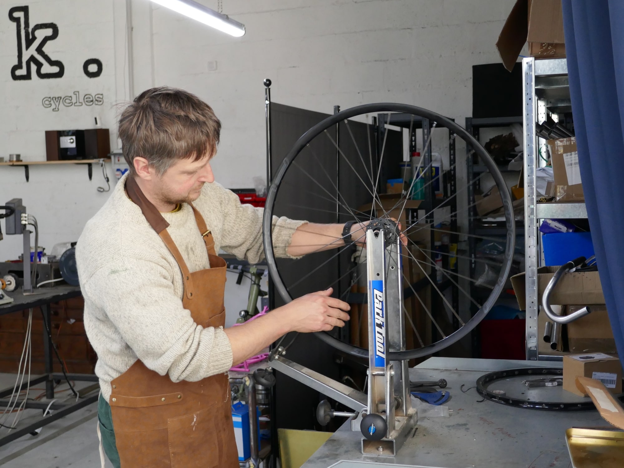 Daniel building a bicycle wheel